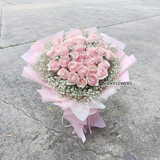 30 light pink roses in light pink wrapping sg florist delivery