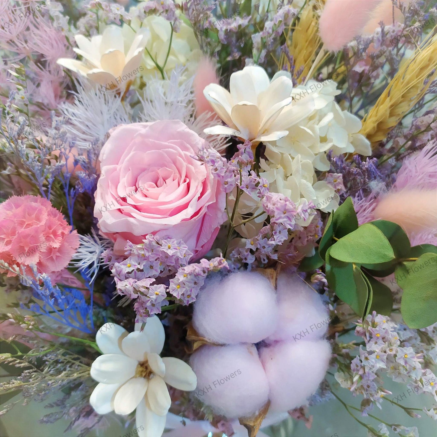 pink cotton pink preserved rose arranement in clear vase