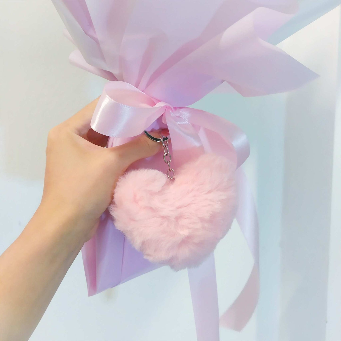 pink baby's breath bouquet with heart keychain
