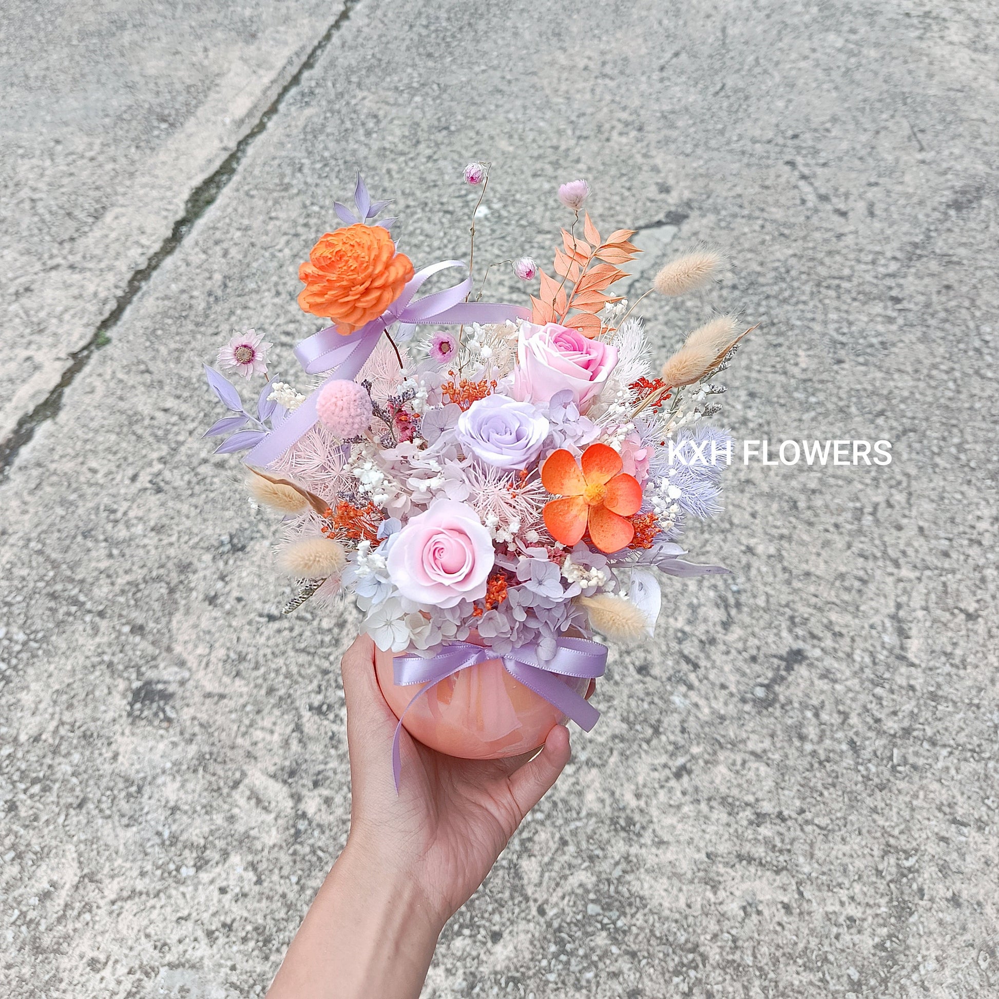 preserved purple and pinks roses with orange flowers arrangement sg florist online delivery