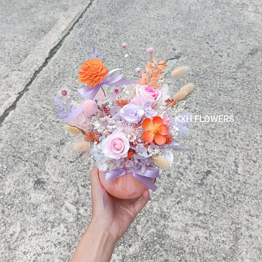 preserved purple and pinks roses with orange flowers arrangement sg florist online delivery