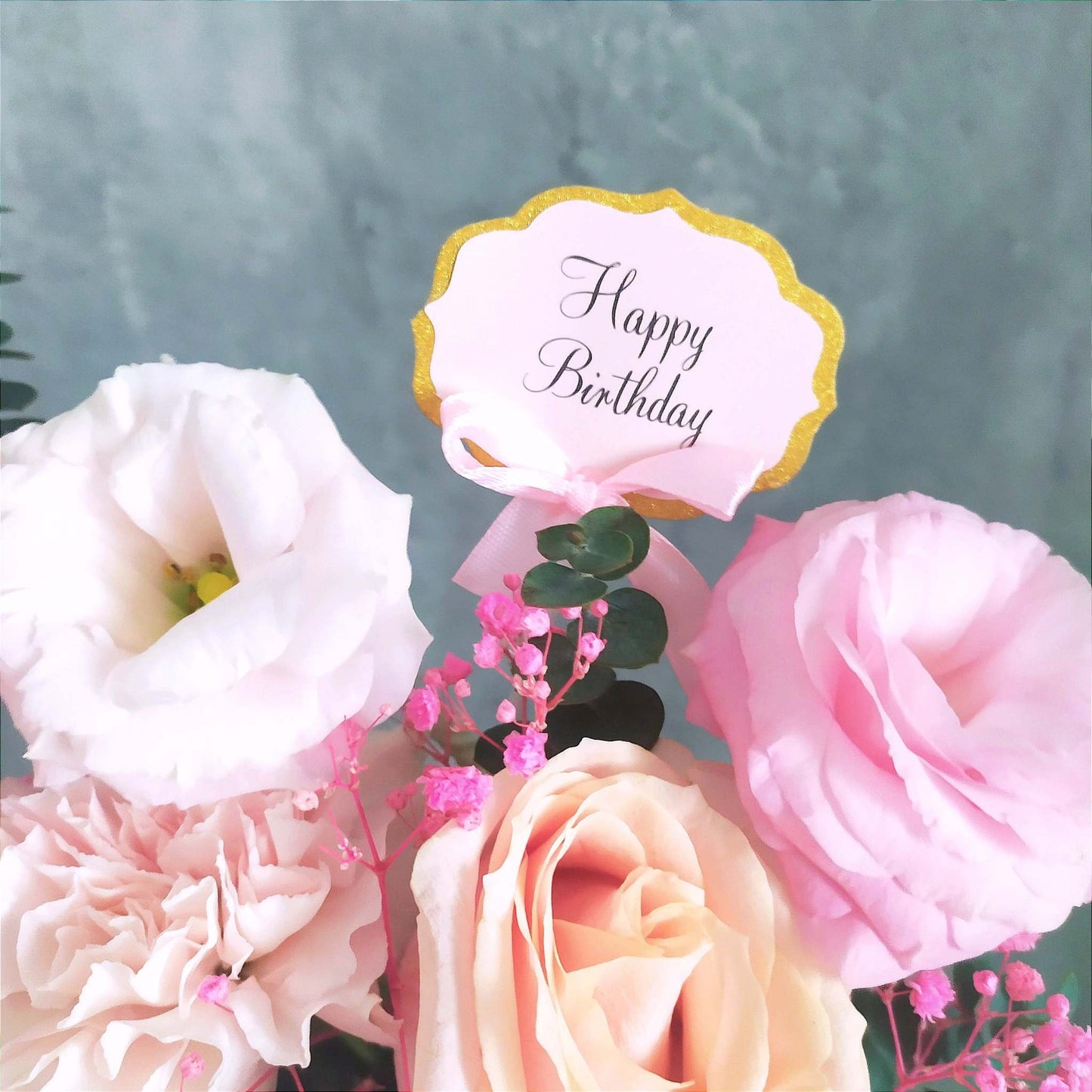 peach roses and pink eustomas flower bag arrangement