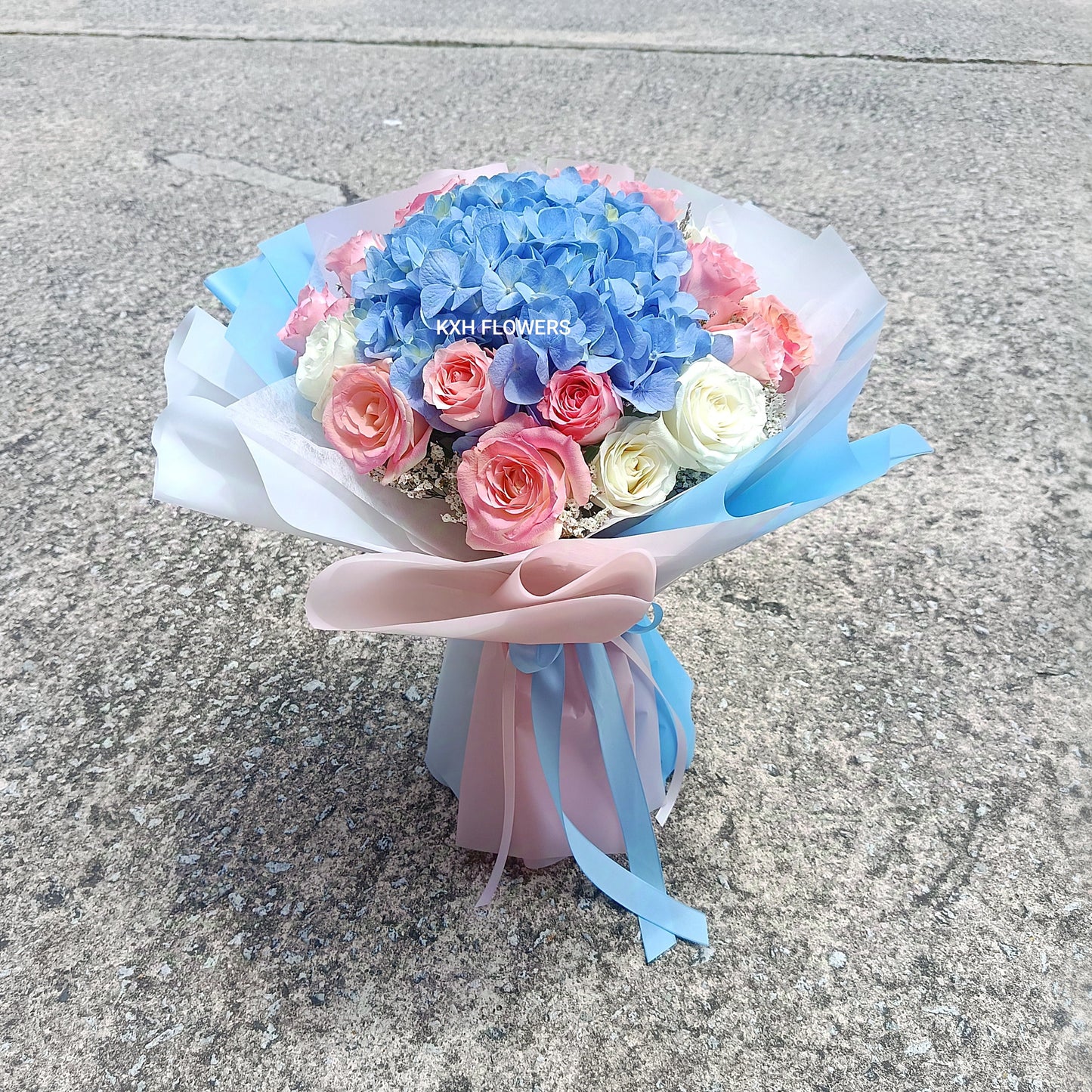 sweet pink and light blue traditional round bouquet singapore delivery