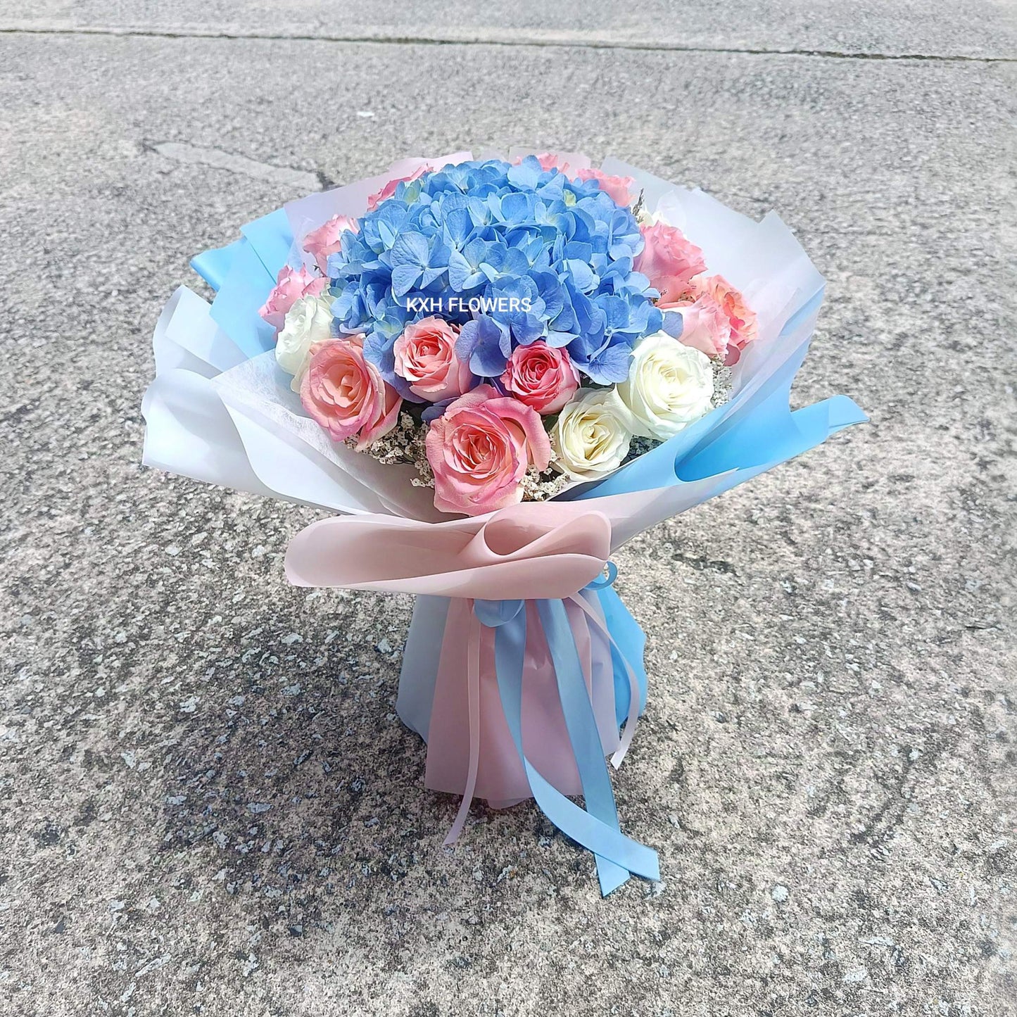 sweet pink and light blue traditional round bouquet singapore delivery