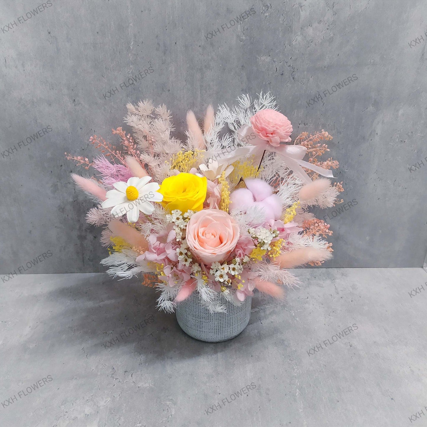 pink and yellow bright and sweet preserved floral arrangement singapore free delivery