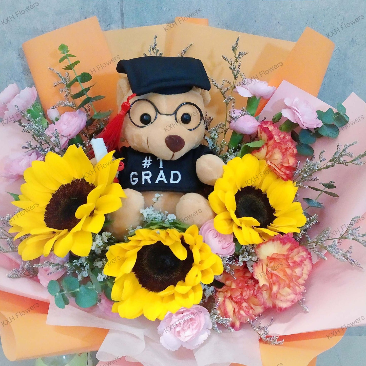 graduation bouquet with bear sunflowers and carnations