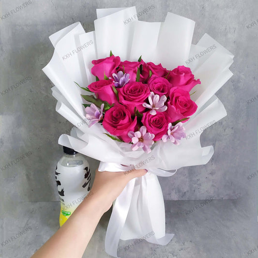 hot pink roses bouquet with purple wood-crafted daisies