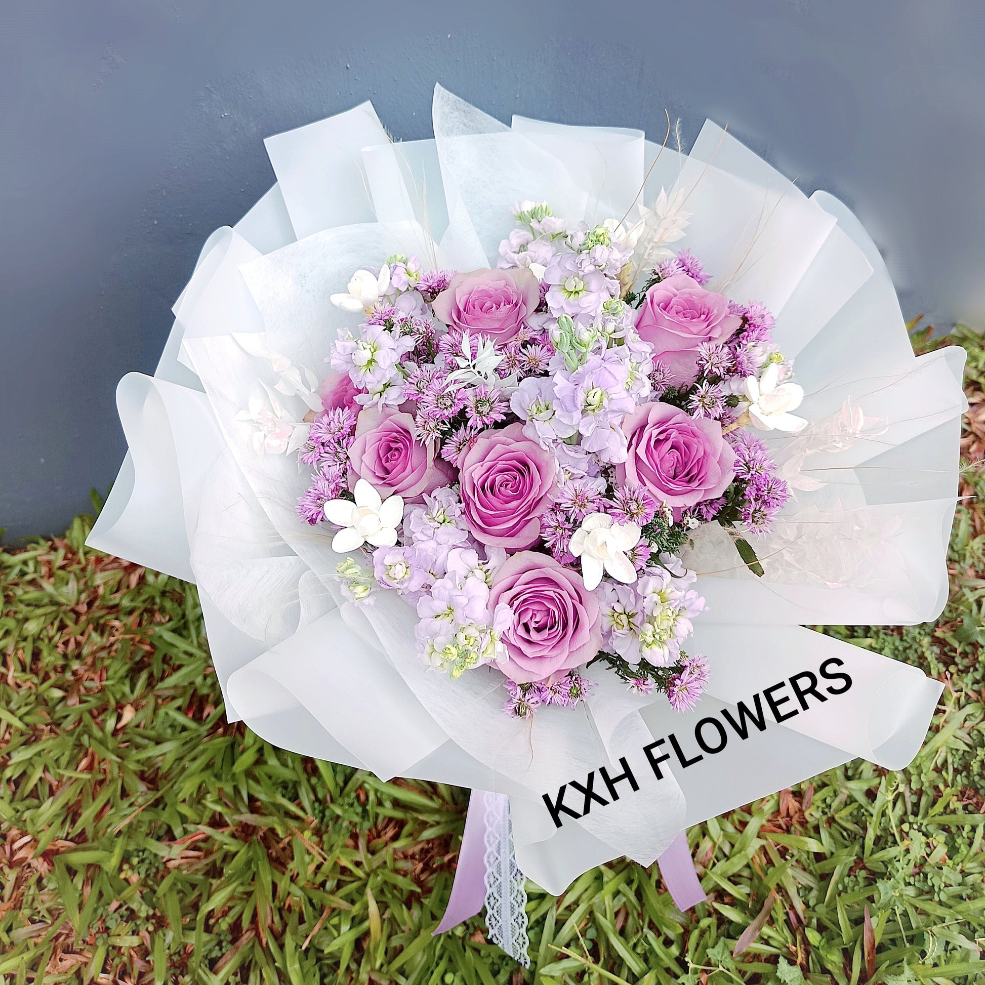 purple roses matthiola mini daisies white flowers stipa grass round bouquet singapore