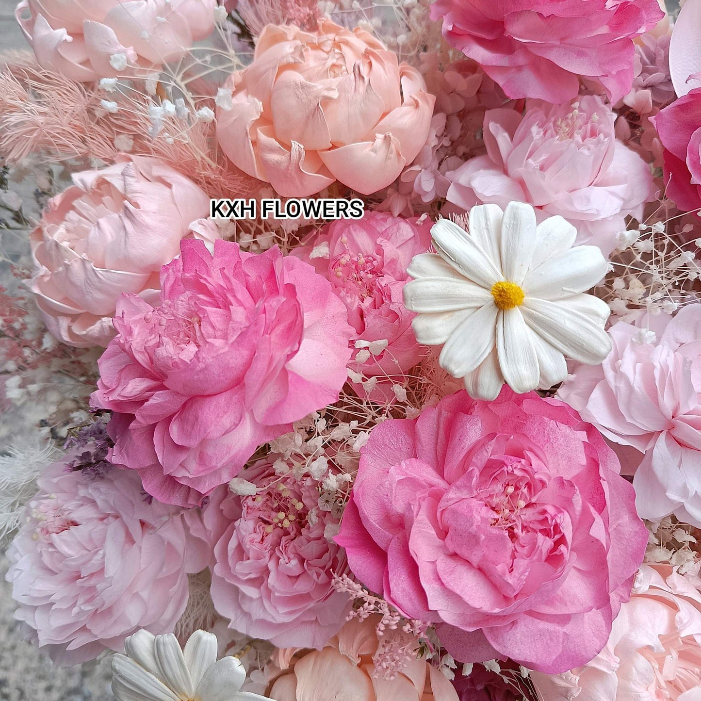 preserved pink peonies and wooden daisies