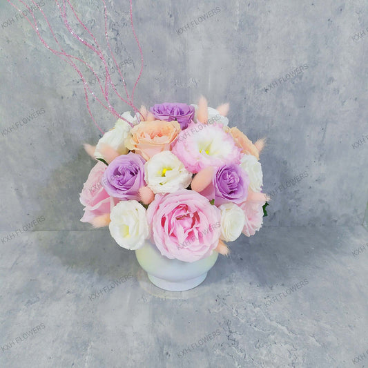 peach purple and pink fresh flower arrangement in vase singapore florist with free delivery