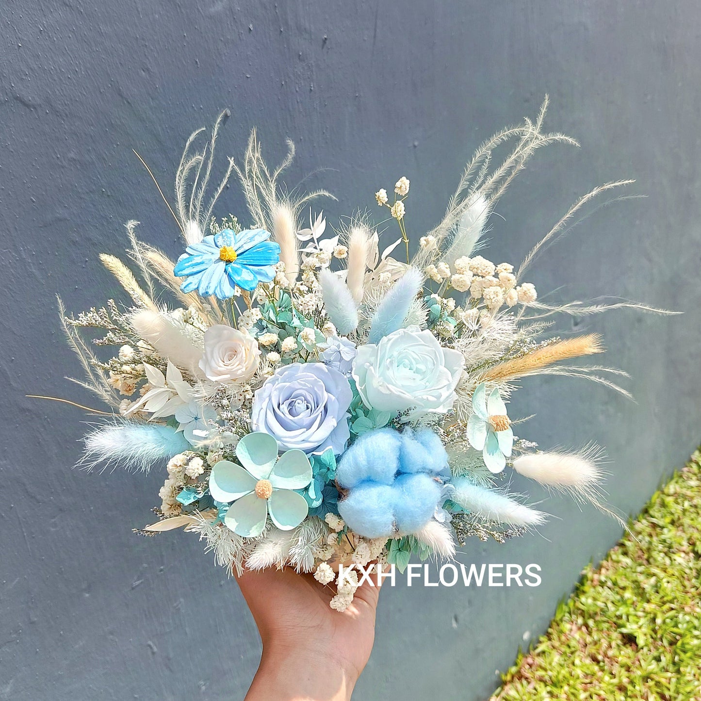 light blue floral arrangement in teacup singapore florist sg delivery