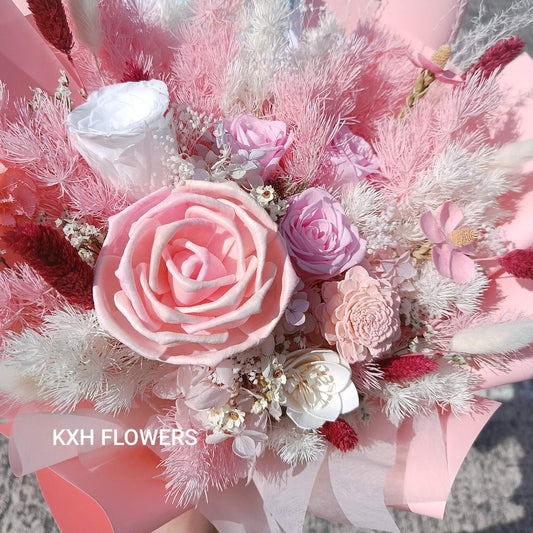 bouquet of 3 pink preserved roses, 1 white preserved rose, premium solawood rose, pink daisies and assorted fillers sg florist