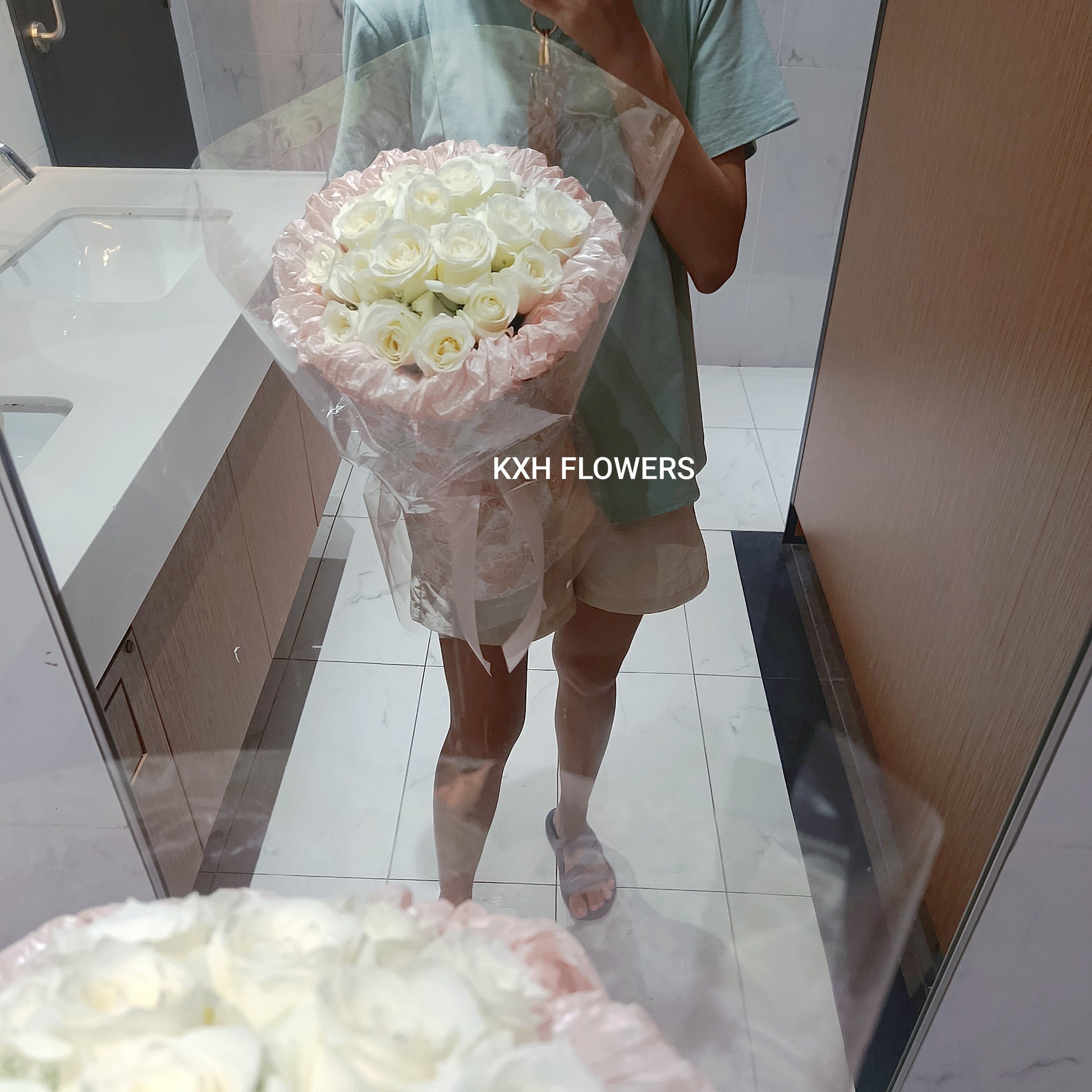 18 fresh white roses in pink wrapping sg florist free islandwide delivery