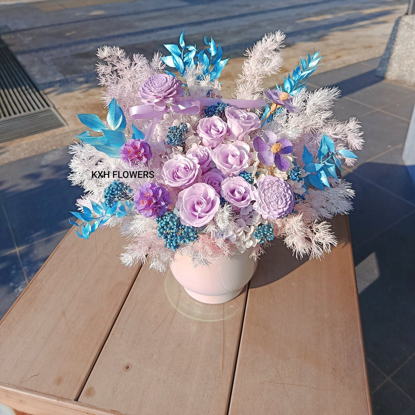 Preserved blue and purple flowers in vase floral arrangement Singapore florist