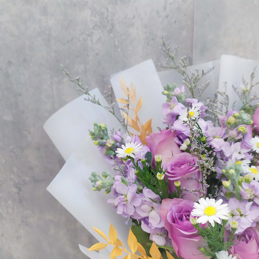 purple roses and matthiolas close up