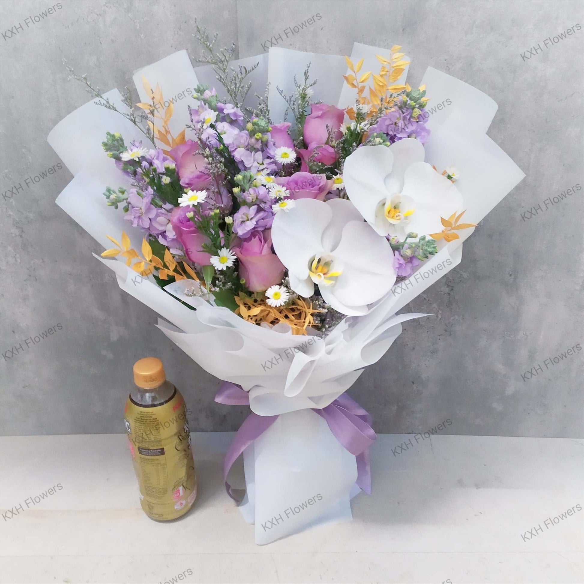 purple roses matthiolas and white moth orchids phalaenopsis bouquet