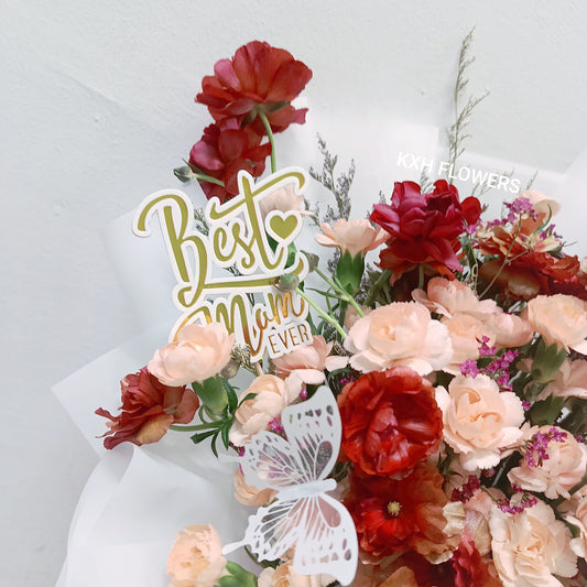 peach carnations with maroon butterfly ranunculus and best mom ever tag sg online florist delivery free