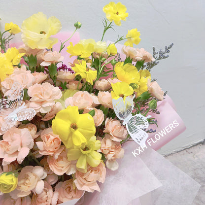 butterfly ranunculus and peach spray carnations