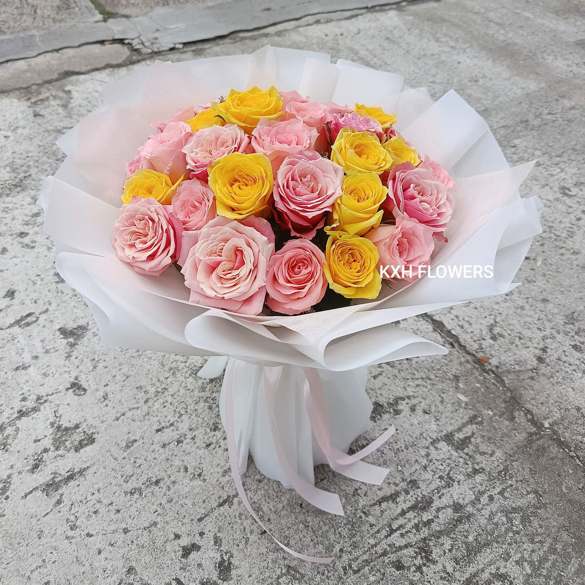 30 stalks of pink and yellow roses white wrapping round bouquet singapore flower delivery