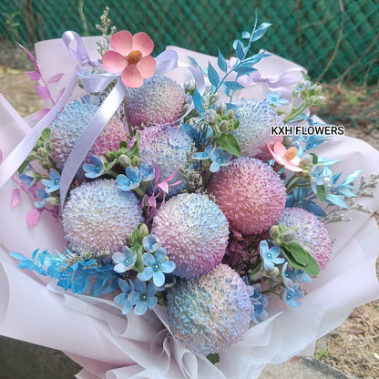 9 ping pong chrysanthemums with blue tweedia and pink wood-crafted daisies sg florist