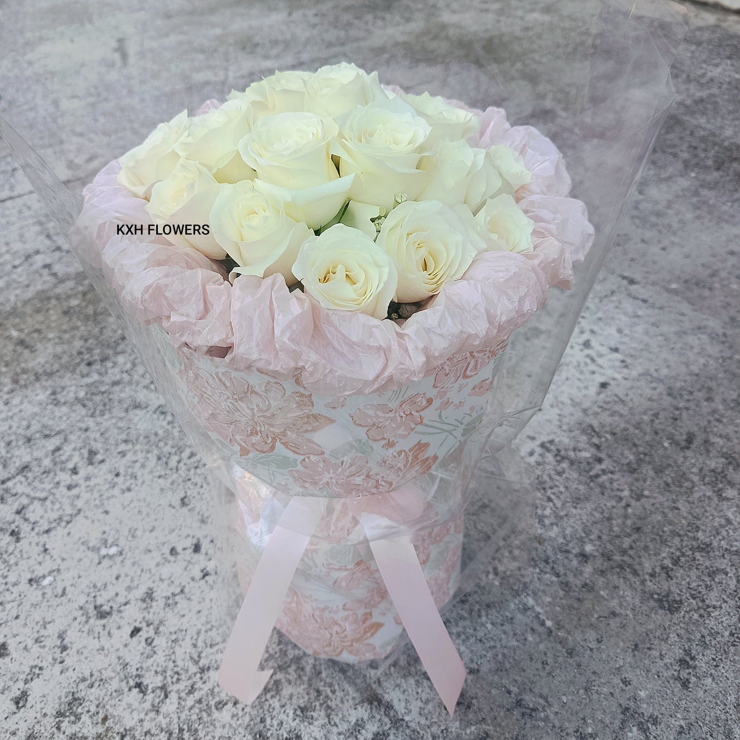 18 fresh white roses with pink wrapping sg florist