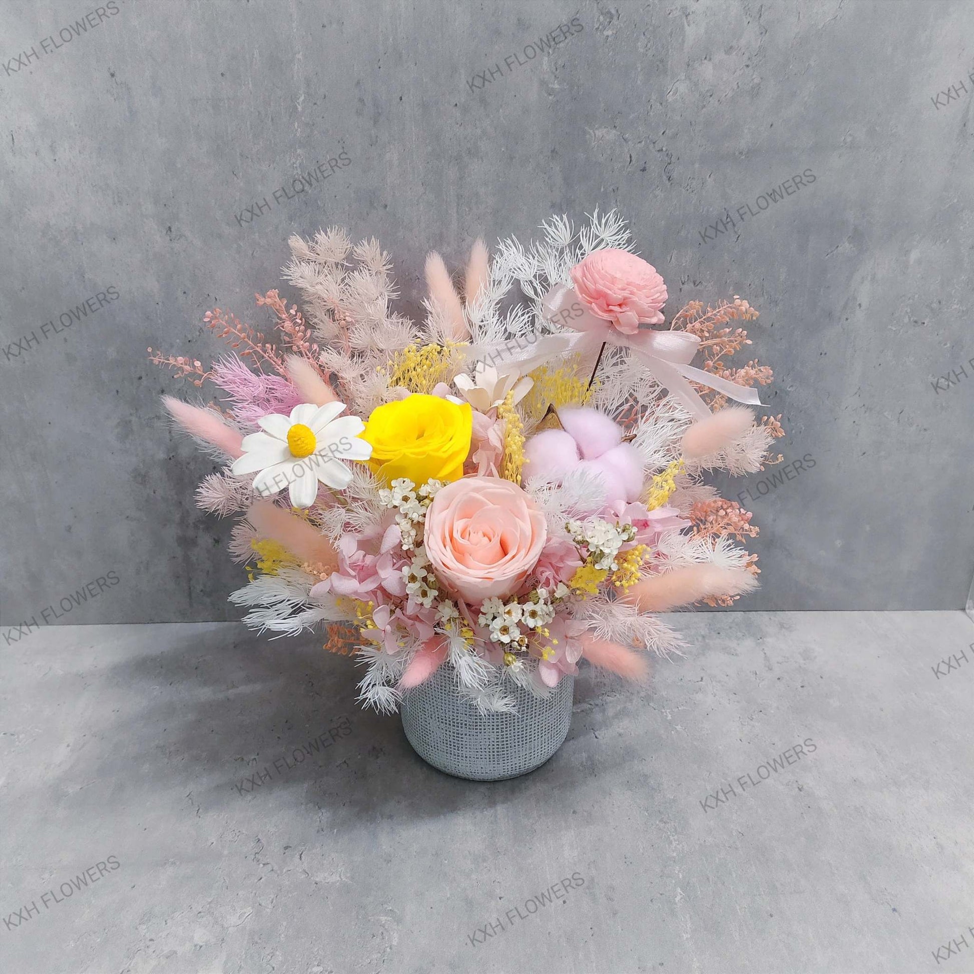 pink and yellow bright and sweet preserved floral arrangement singapore free delivery