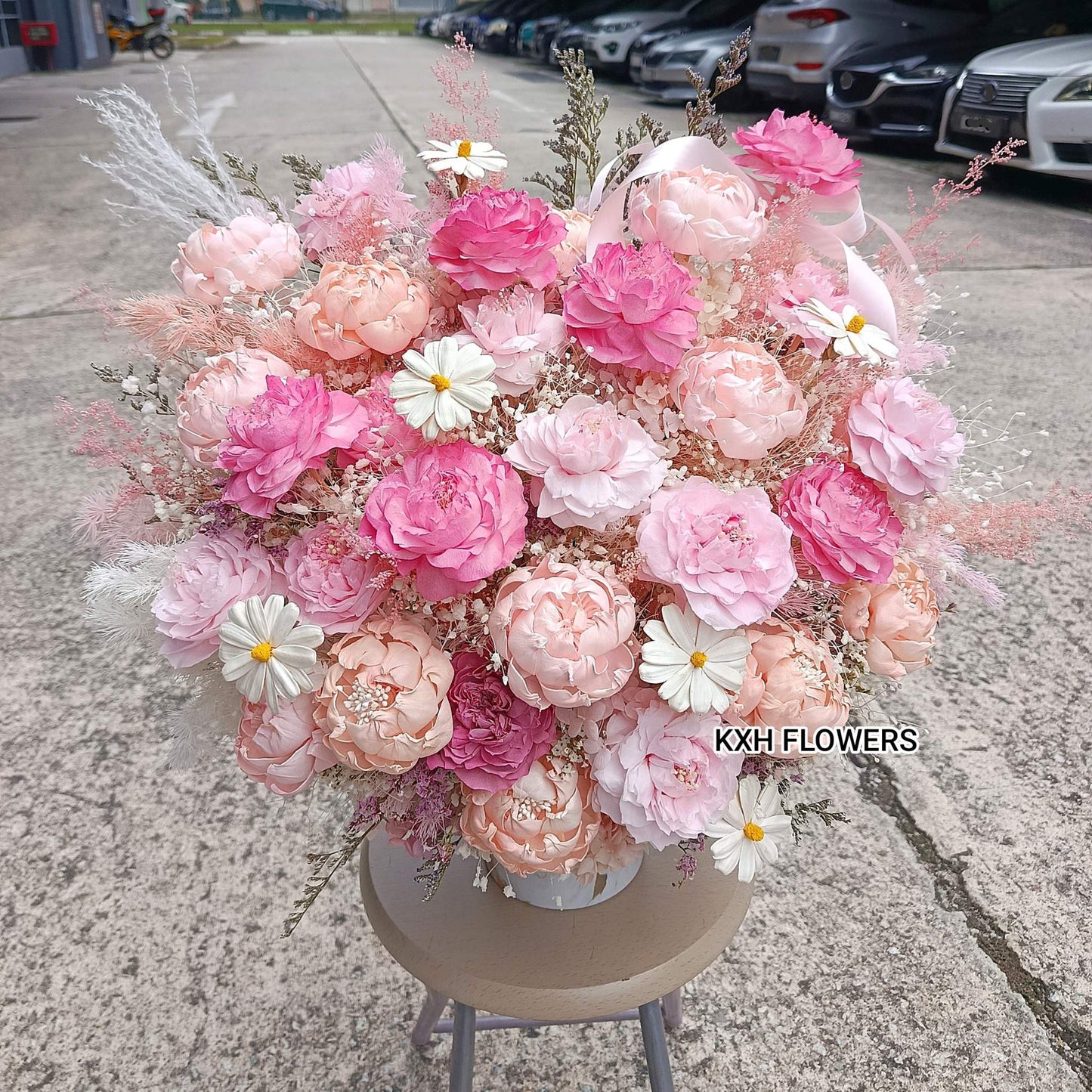 solawood and preserved pink peonies arrangement sg florist