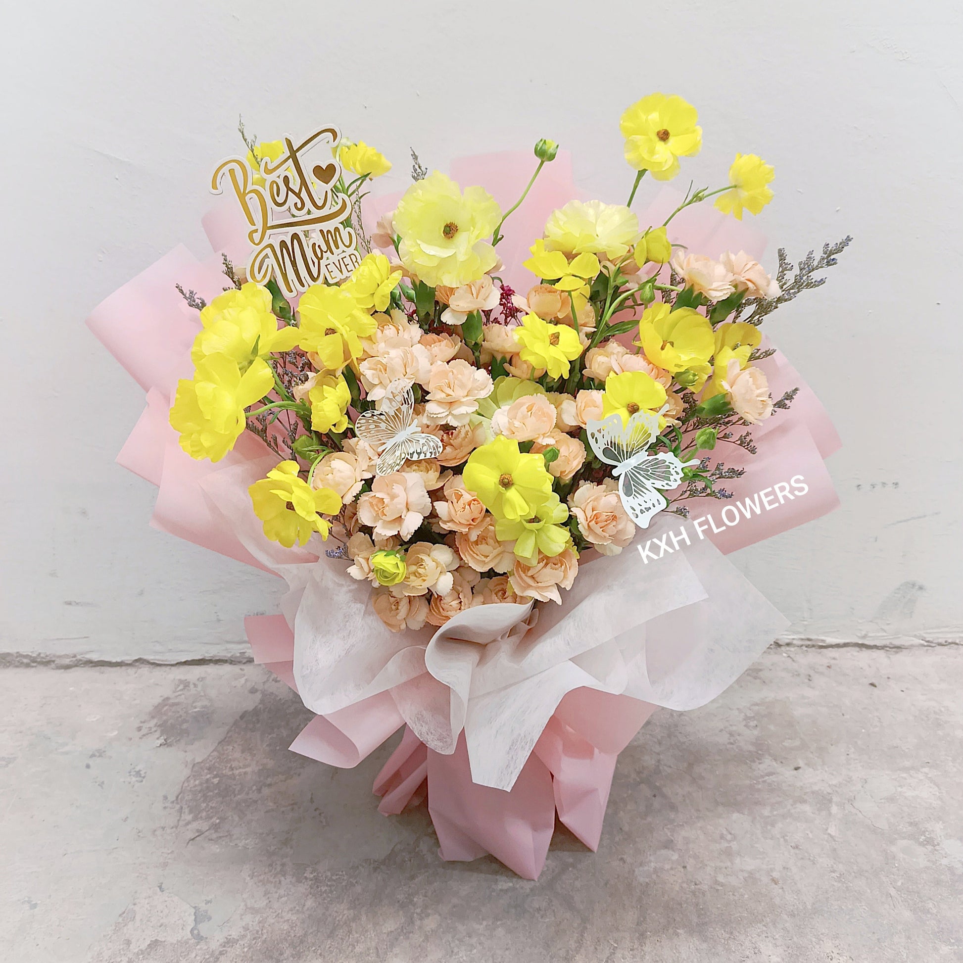 peach carnations yellow butterfly ranunculus best mom ever tag pink wrapping free delivery singapore florist kallang