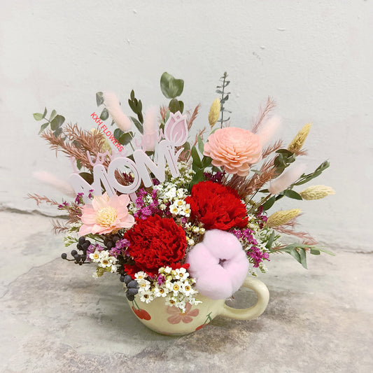 preserved flowers red carnations pink flowers teacup arrangement