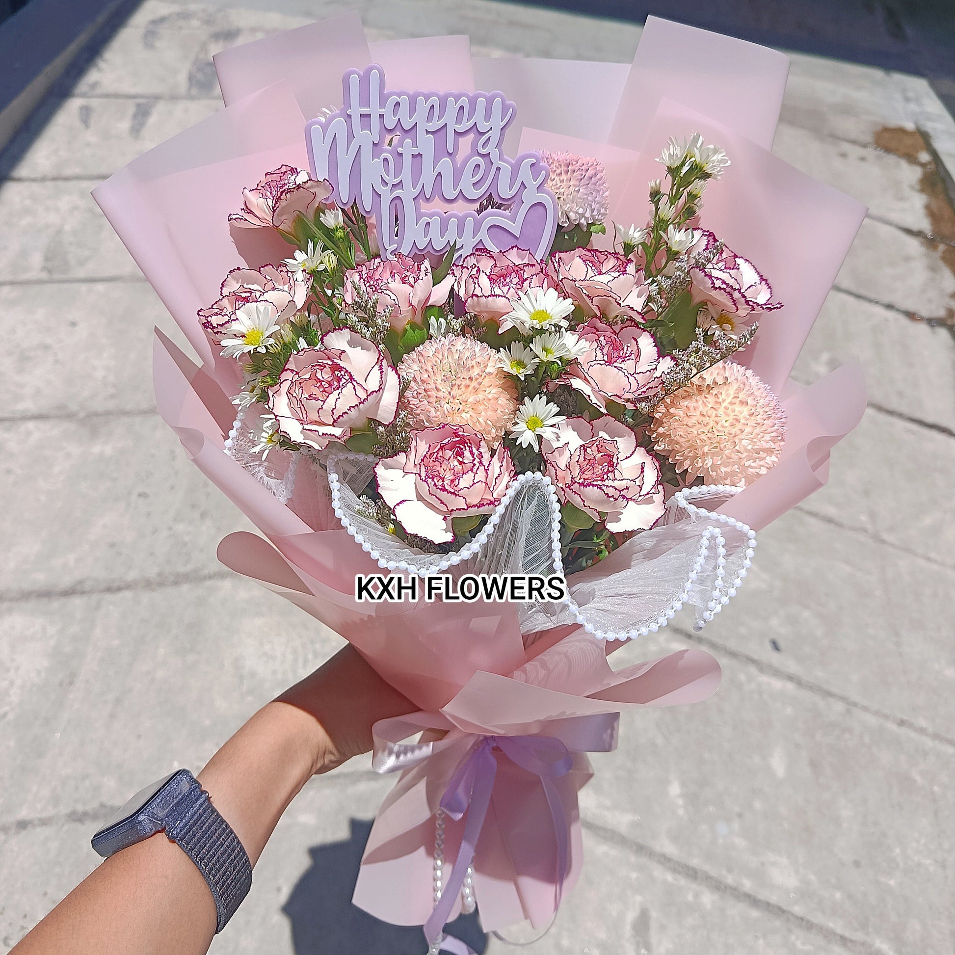 10 purple carnations in pink wrapping for mother's day gifting sg florist free delivery included