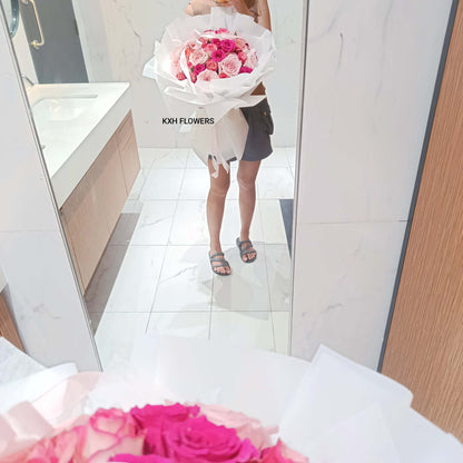 person holding pink roses bouquet sg florist