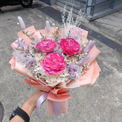 dark pink preserved peonies and light purple fillers singapore florist