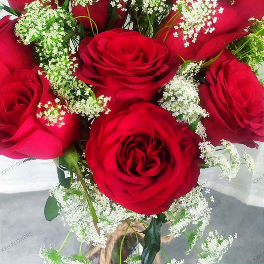 hand-tied red roses bouquet in clear bottle vase sg florist free delivery