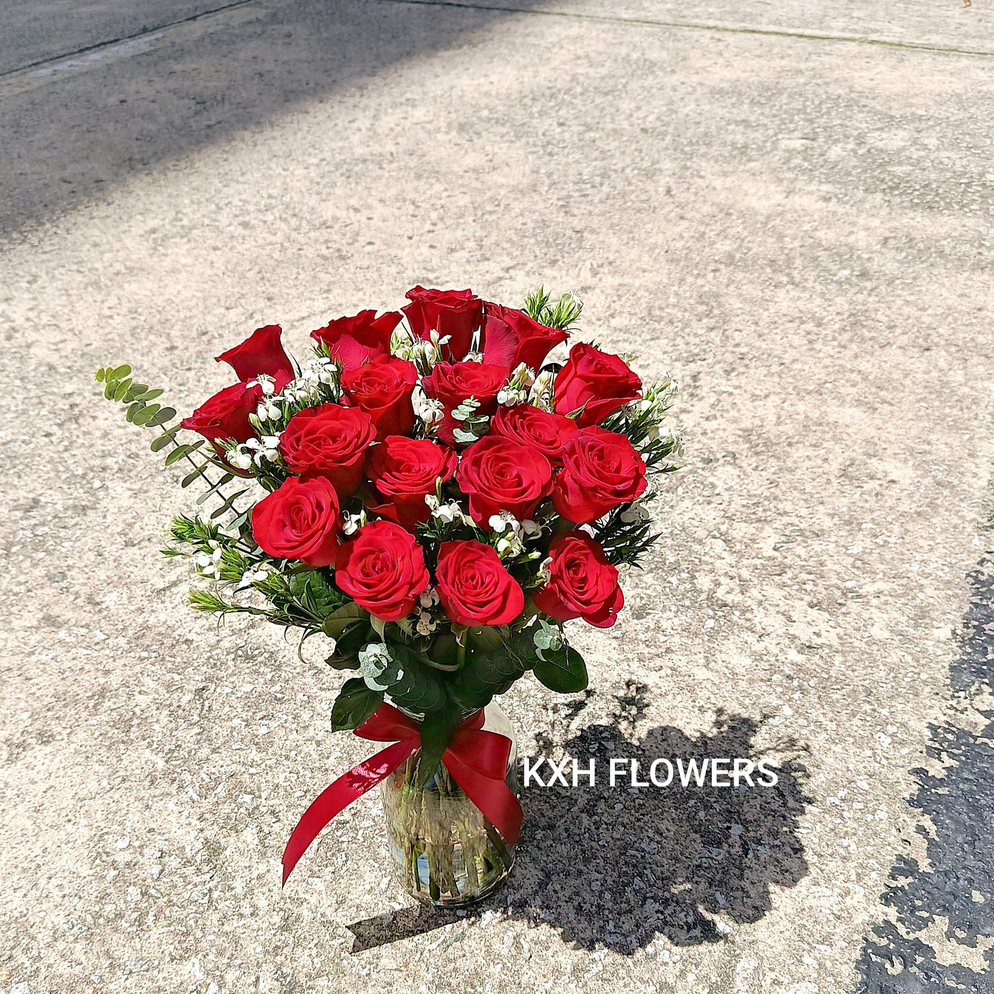 Hand-tied 17 red roses placed in clear vase singapore florist free delivery