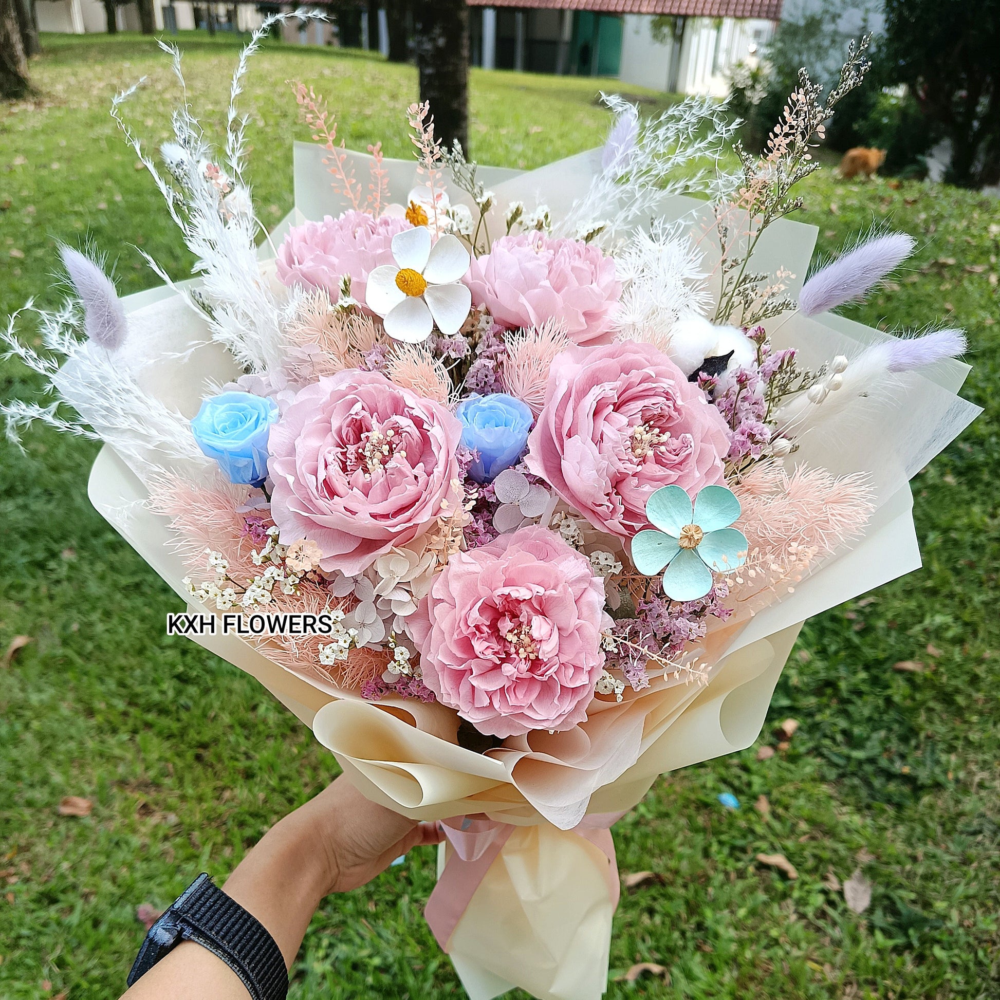 dusty pink preserved peonies and mini blue roses singapore florist delivery