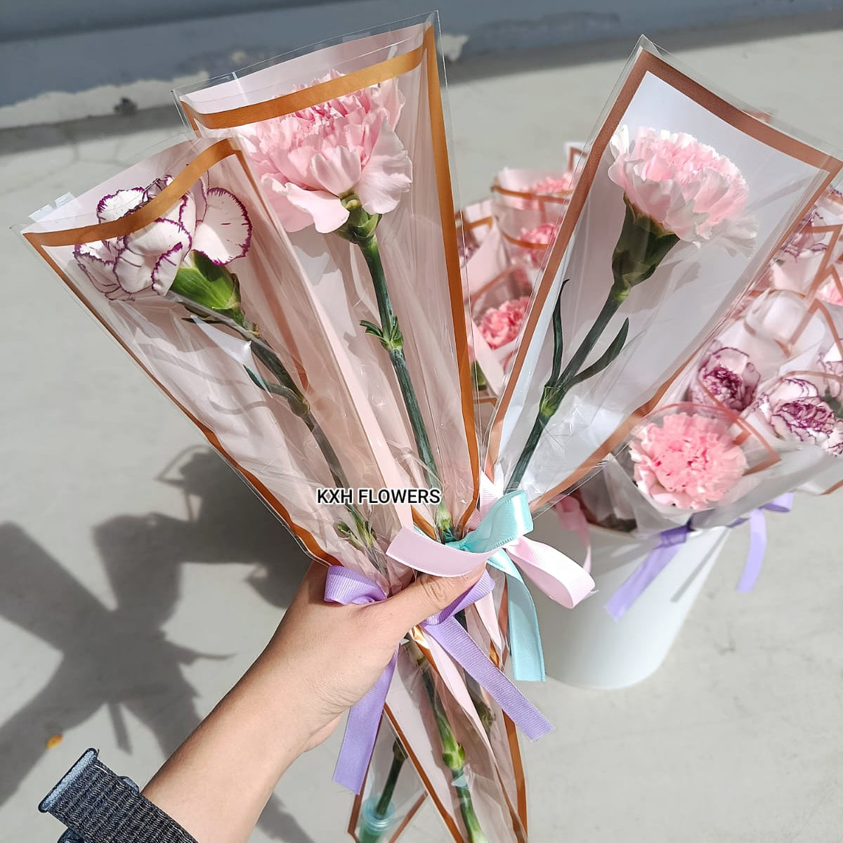 single stalk pink carnation for marketing event sg florist