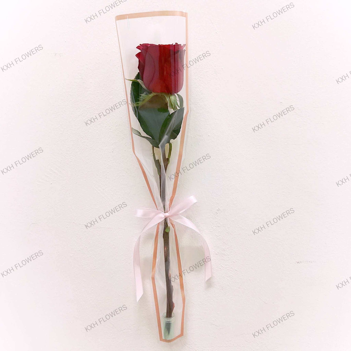 single stalk red rose in sleeve singapore florist delivery