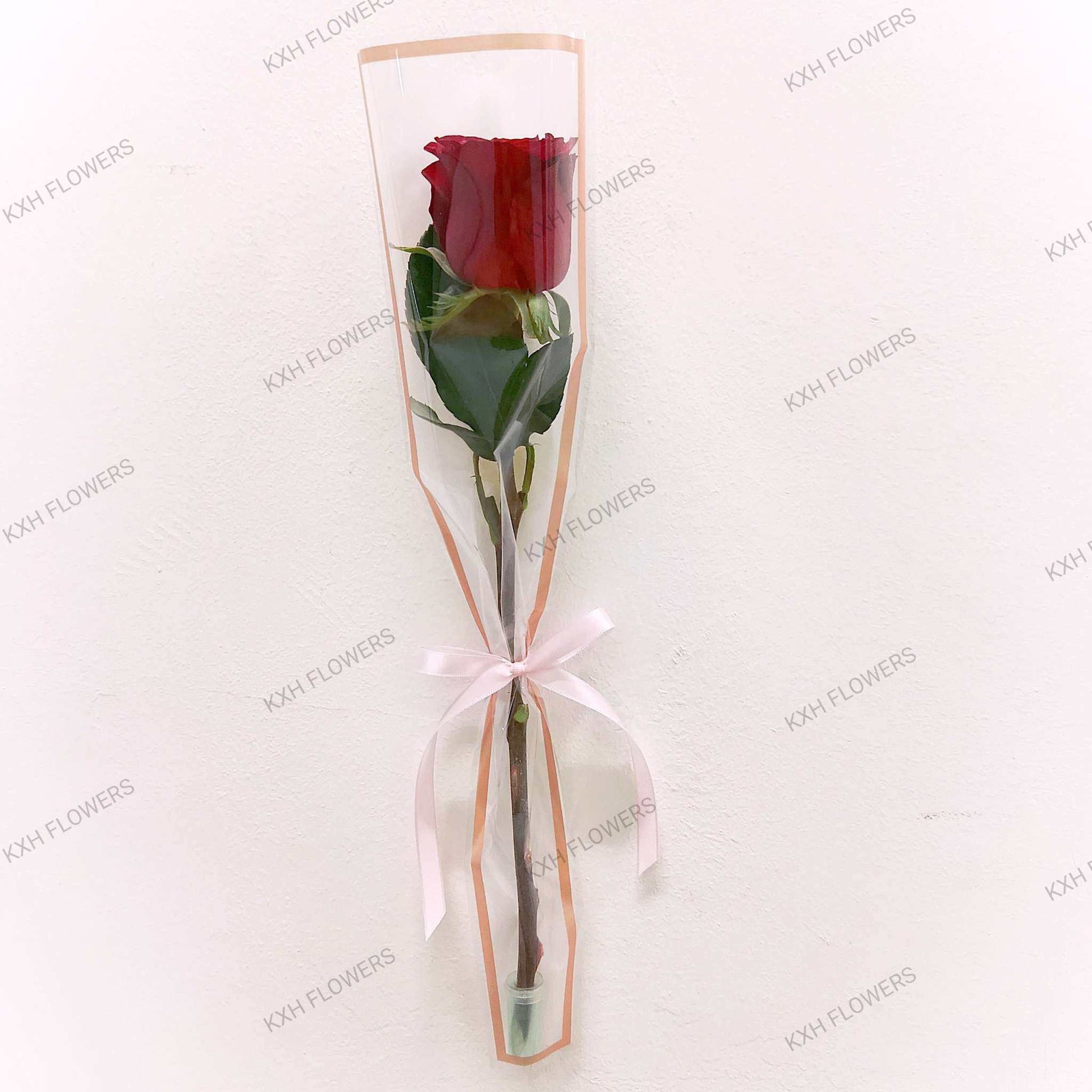 single stalk red rose in sleeve singapore florist delivery