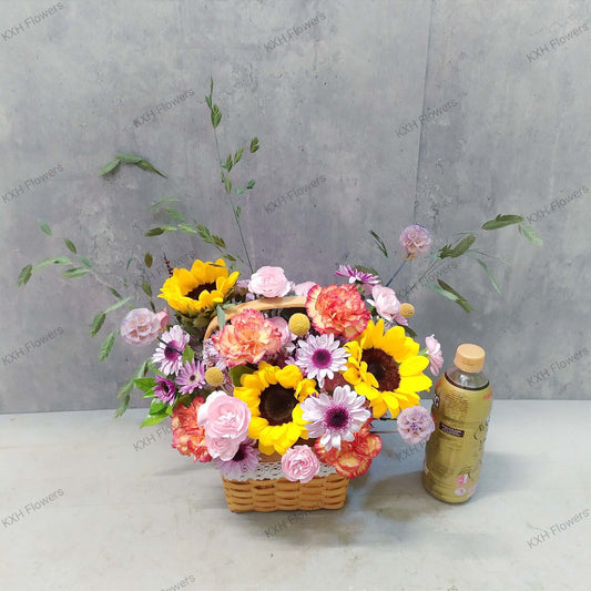 3 sunflowers with orange carnations and purple chrysanthemum daisies