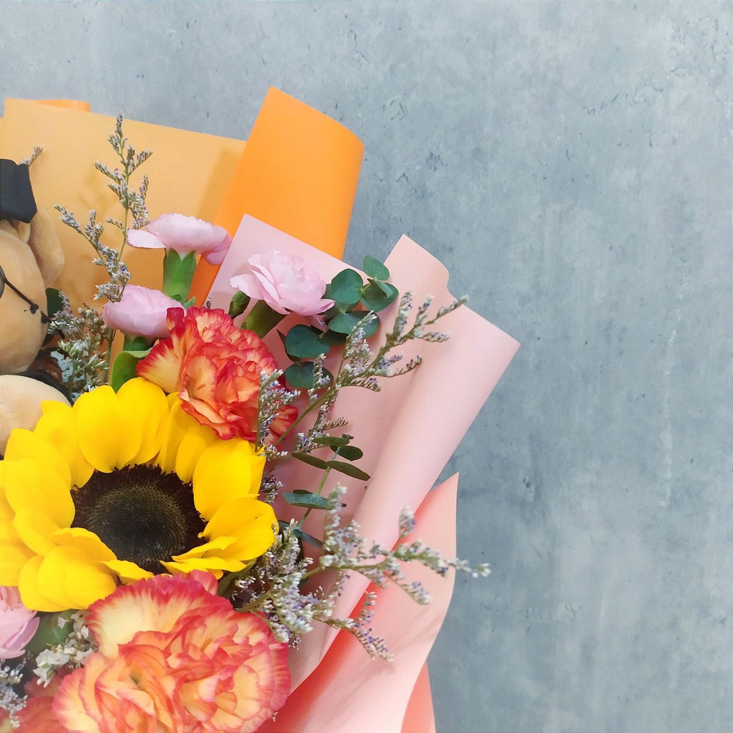 sunflower and orange carnations