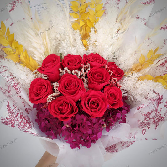 preserved red roses bouquet with gold leaves and burgundy hydrangeas